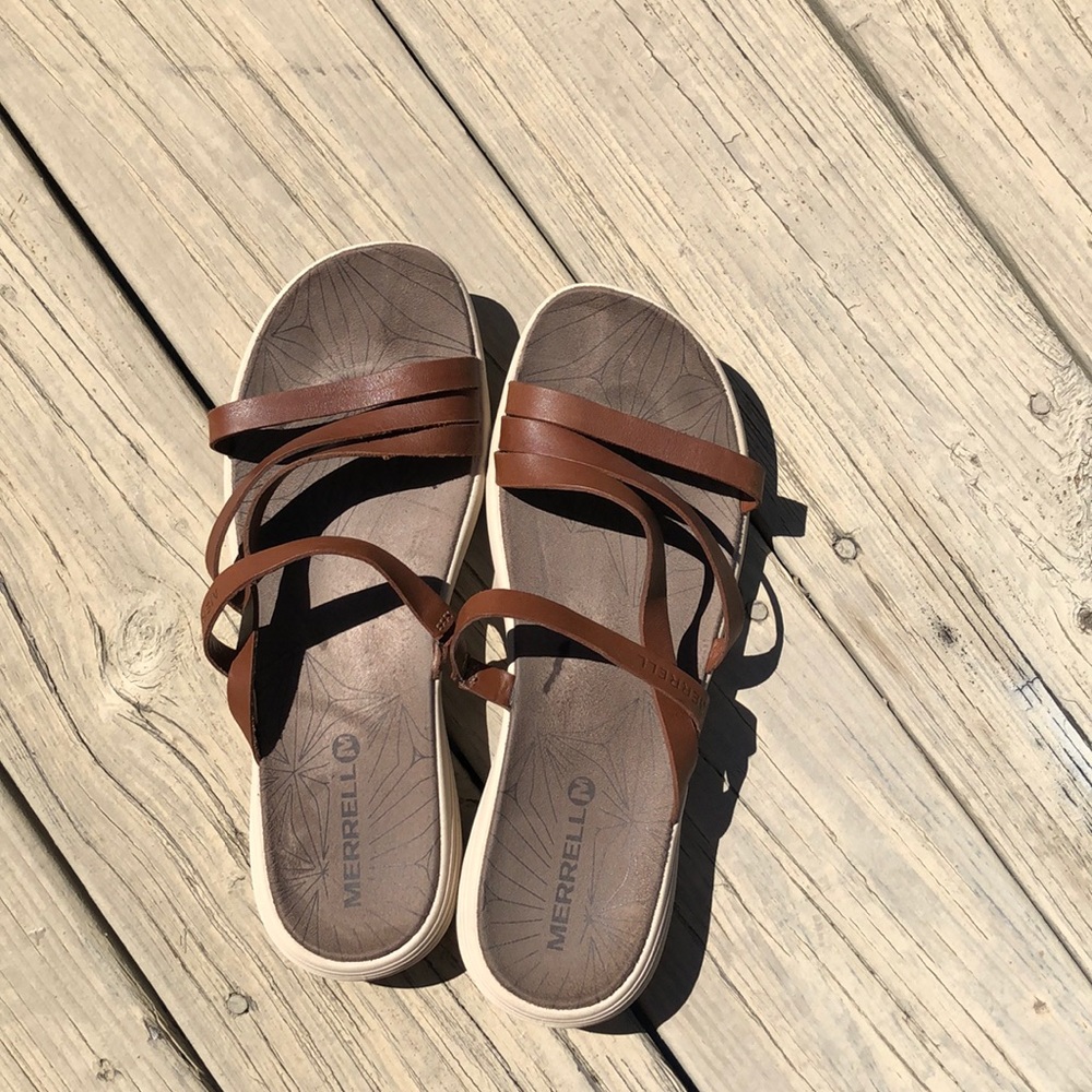 Brown merrell slip on sandals.